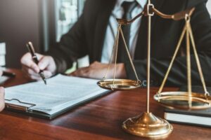 lawyer writing on letter
