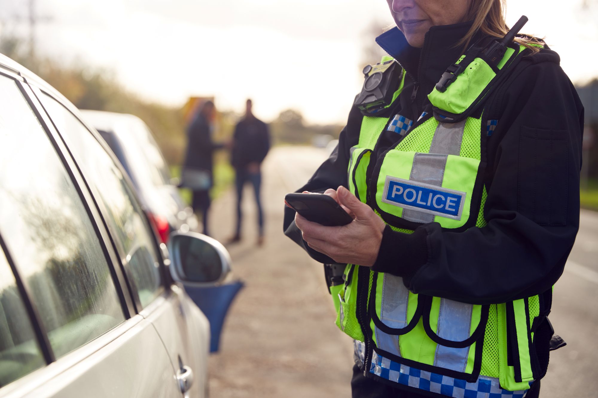 police officer recording details of wreck
