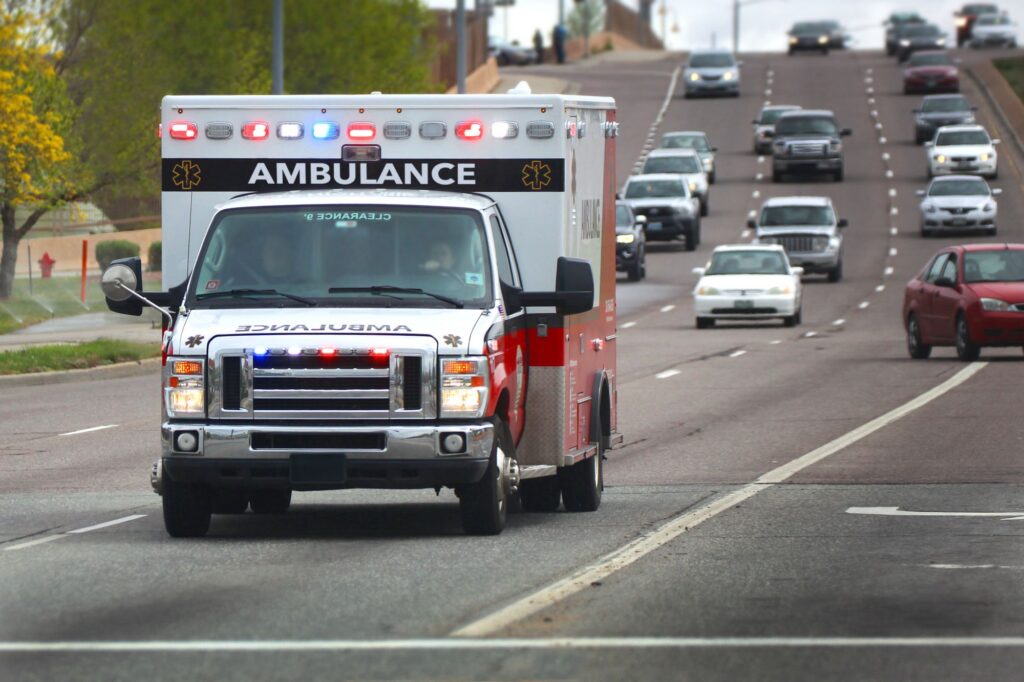 ambulance driving with lights on