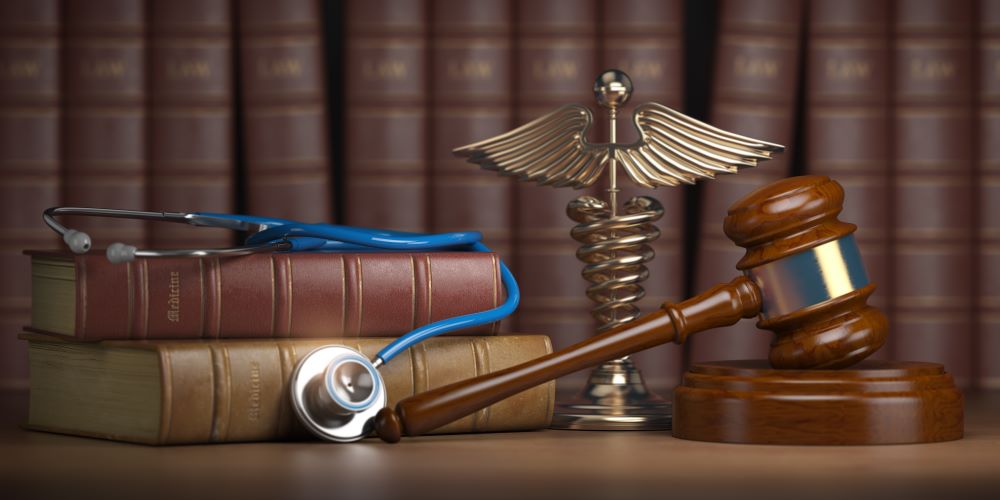 gavel, law books, stethoscope